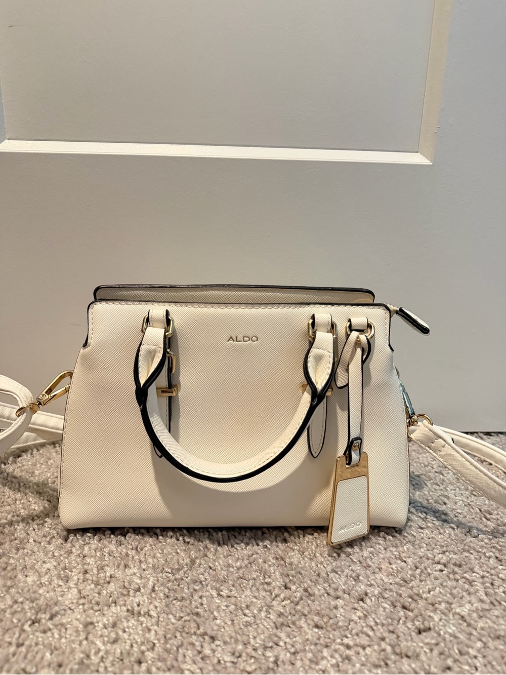 Aldo White Leather Handbag with Black trim and Gold handles!